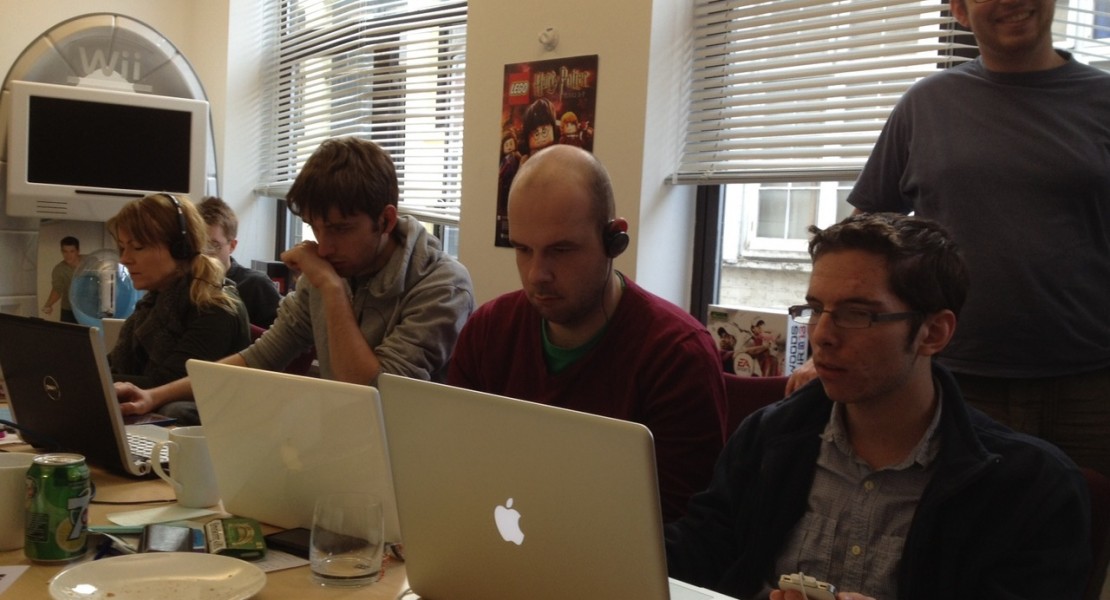 The game jam teams that are still working away into the morning. In the picture is David Jones, Kevin Chandler, and on the far end is Jo Twist, the CEO of UKIE.